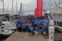 event attendees wearing their matching rendezvous tshirts posing in group