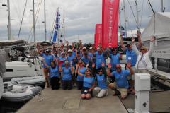 event attendees wearing their matching rendezvous tshirts posing in group