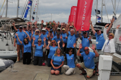 event attendees wearing their matching rendezvous tshirts posing in group
