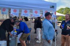 event attendees getting drinks outside 