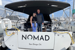 Two new owners aboard sailboat named 'Nomad'