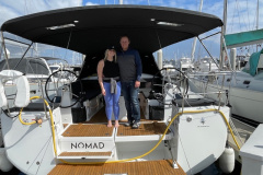 Two new owners aboard sailboat named 'Nomad'