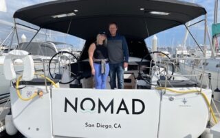 Two new owners aboard sailboat named 'Nomad'